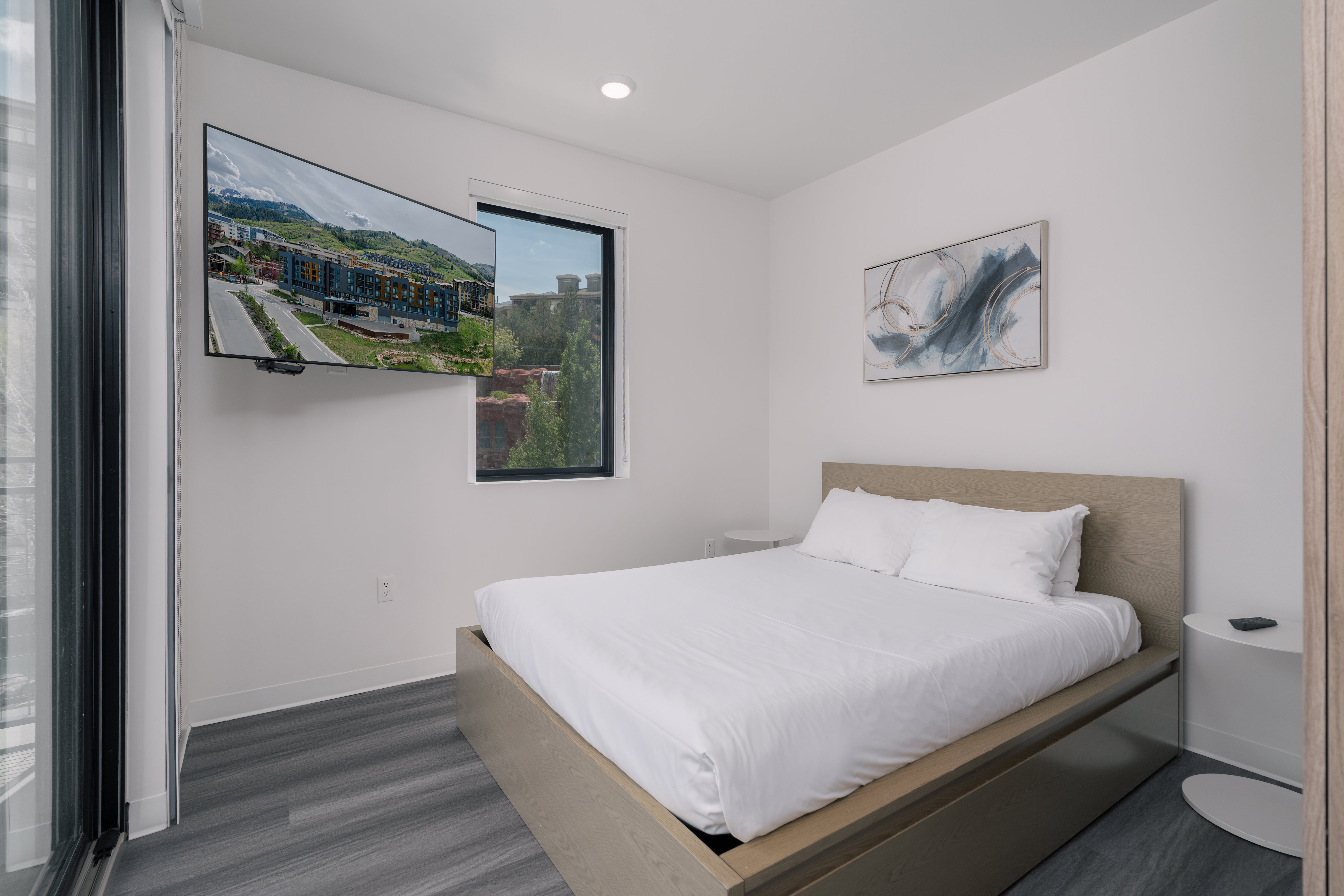 Bedroom with wood finished floors, baseboards, and recessed lighting