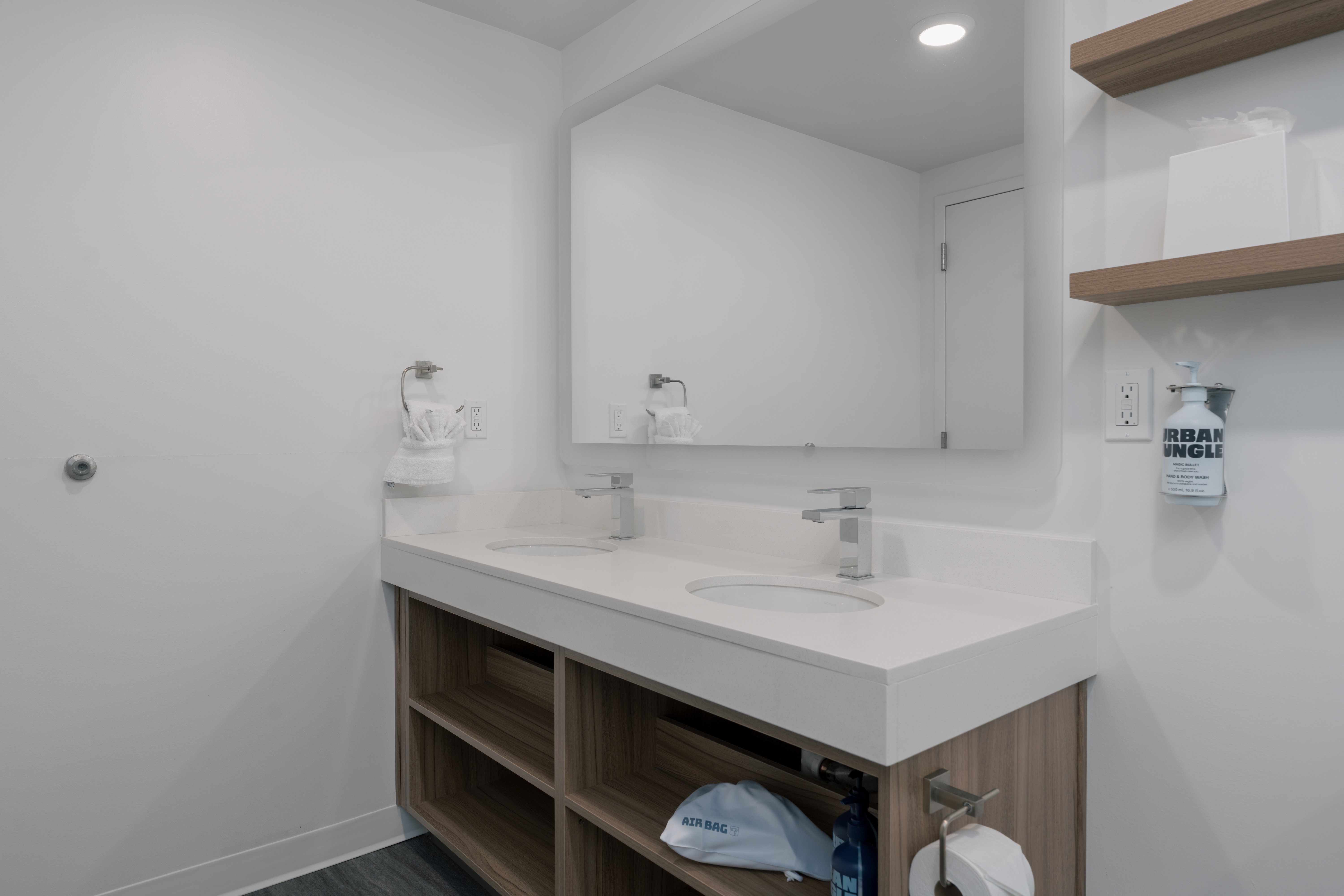 Bathroom with double vanity and recessed lighting
