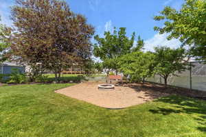 View of yard featuring a fire pit