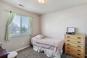 Carpeted bedroom with baseboards