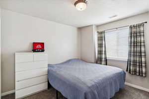 Bedroom with carpet and baseboards