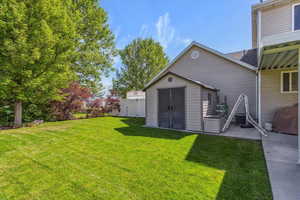 View of yard featuring a patio and central air condition unit