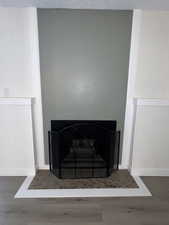 Detailed view of wood finished floors and baseboards