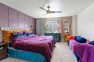 Bedroom featuring light colored carpet and ceiling fan