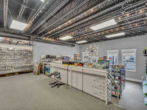 Miscellaneous room featuring carpet flooring and baseboards