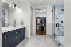 Main level Primary ensuite walk-in shower with tub. Large walk-in closet with washer and dryer.
