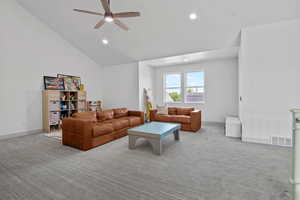 Second level large living area featuring ceiling fan, carpet, high vaulted ceiling, recessed lighting.