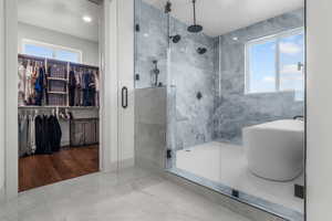 Main level Primary ensuite walk-in shower with tub. Large walk-in closet with washer and dryer.