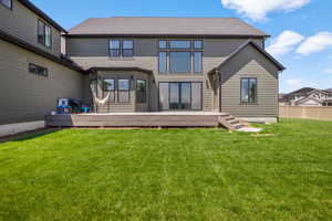 Rear view of property with a deck
