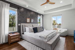 Main level Primary bedroom with ensuite, accent wall and private access to the rear deck.