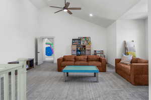 Second level large living area featuring ceiling fan, carpet, high vaulted ceiling, recessed lighting.