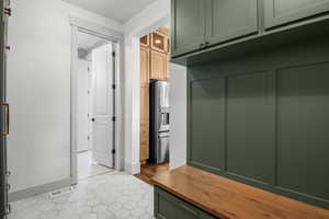 Mudroom with access to powder room and kitchen.