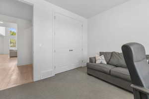 Carpeted living room with baseboards