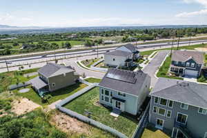 Aerial perspective of suburban area with a mountain backdrop