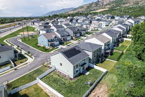 Aerial view of residential area featuring a mountainous background