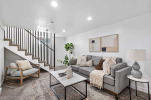 Living room featuring stairway and recessed lighting