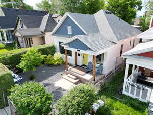 View of front of home with roof with shingles