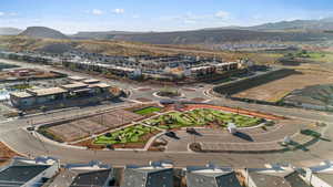 Aerial perspective of suburban area featuring a mountain backdrop