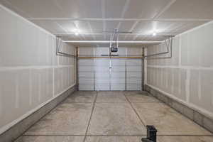 Garage featuring a garage door opener