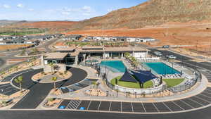 Aerial view of property's location with a pool area and mountains