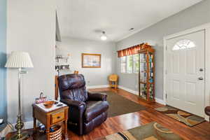 Living room featuring wood finished floors and baseboards
