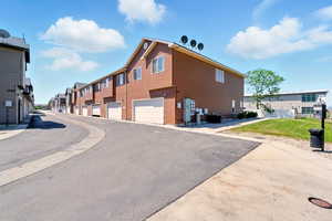 View of asphalt street with a residential view