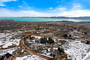 Aerial overview of property's location featuring a water and mountain view