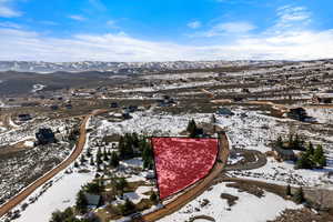 Snowy aerial view with a mountain view