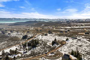 Aerial overview of property's location featuring a mountain backdrop