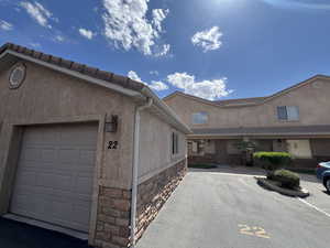 View of front facade featuring stucco siding