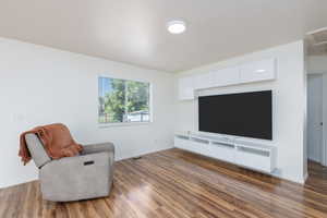 Living area featuring wood finished floors and baseboards