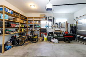 Garage featuring a garage door opener