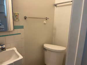 Bathromm, View #2,  with a sink, a tile shower, and toilet