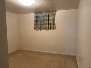 Bedroom with carpet floors and baseboards