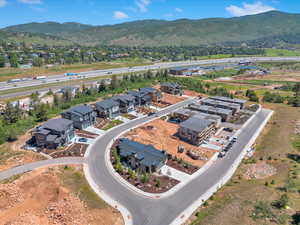 Aerial perspective of suburban area featuring a mountain backdrop