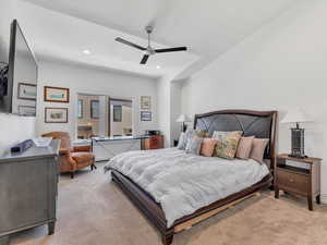 Bedroom featuring light carpet, a ceiling fan, and recessed lighting