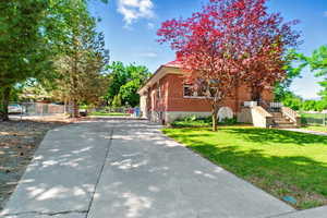 View of side of property with brick siding