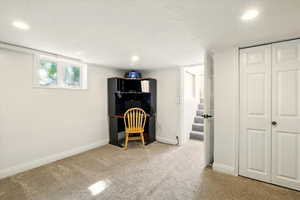Unfurnished office with carpet flooring, baseboards, and recessed lighting