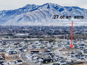 Aerial overview of property's location featuring a mountain backdrop