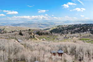 View of mountain backdrop featuring rural landscape