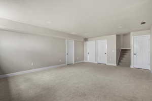 Unfurnished bedroom with baseboards and carpet floors
