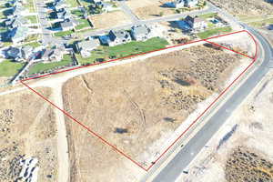 Aerial view of residential area featuring property boundaries highlighted