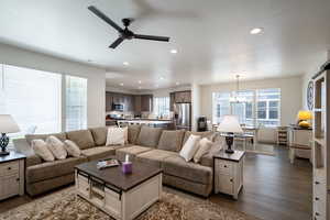 Living area with wood finished floors, plenty of natural light, ceiling fan, and recessed lighting