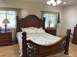 Bedroom with light wood finished floors
