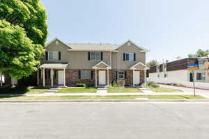 View of front of home featuring brick siding