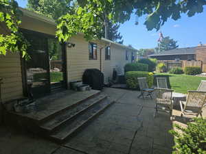 View of patio featuring area for grilling