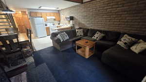 Living room with brick wall