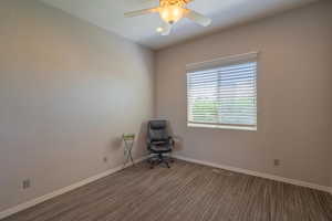 Unfurnished room featuring baseboards, carpet floors, and ceiling fan