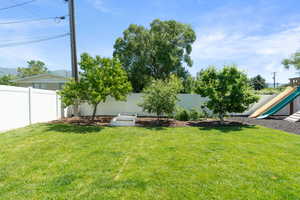 View of yard featuring a playground