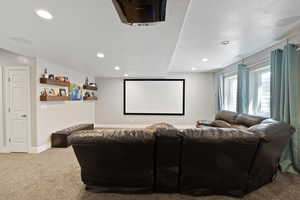 Carpeted cinema featuring recessed lighting and baseboards